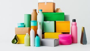 A neatly assembled pile of modern, colourful sustainable packaging